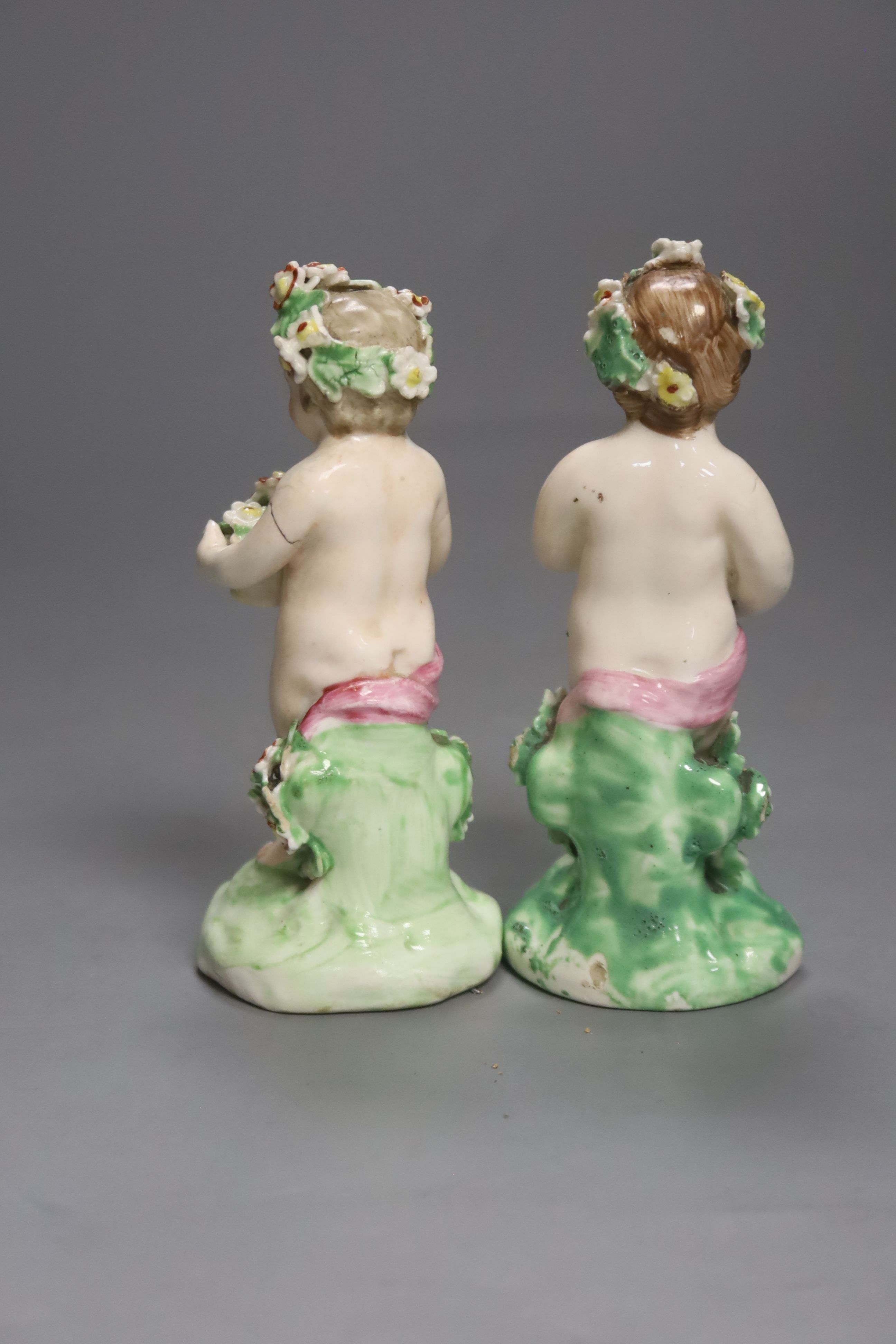 A good pair of Derby figures of children holding baskets of flowers c. 1760, patch marks, firing crack to one arm, height 11.5cm